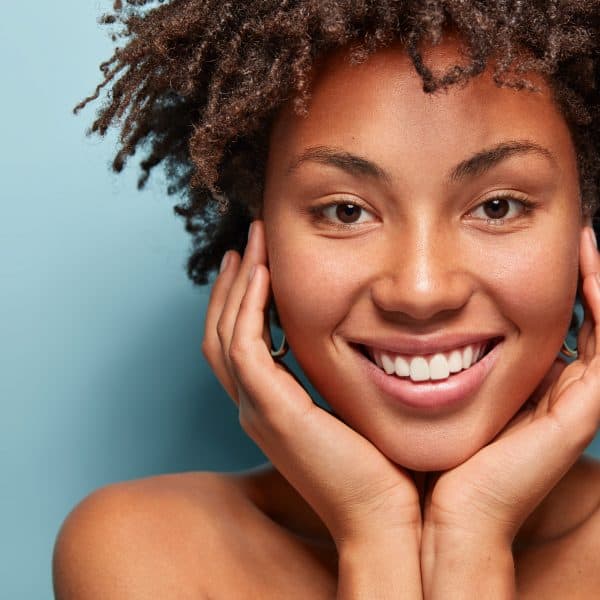 Black woman with beautiful skin showing benefits of VIE AquaFacial treatment