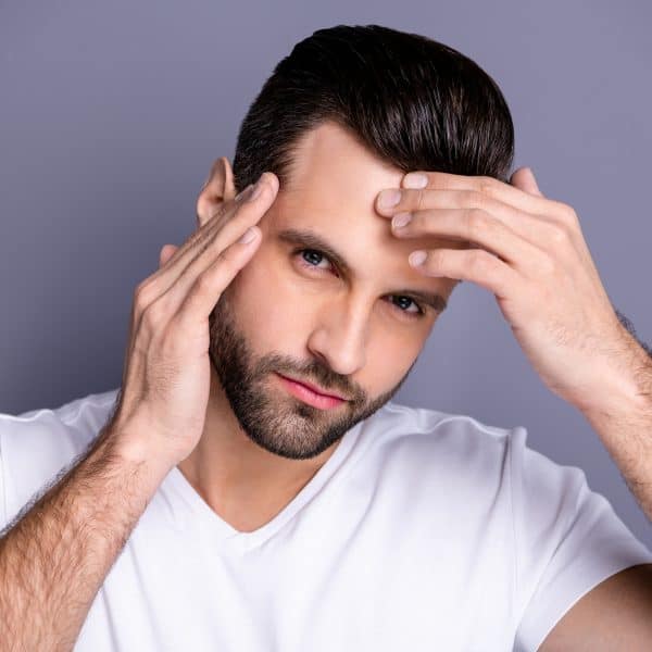 Man with smooth forehead after a non-surgical brow lift