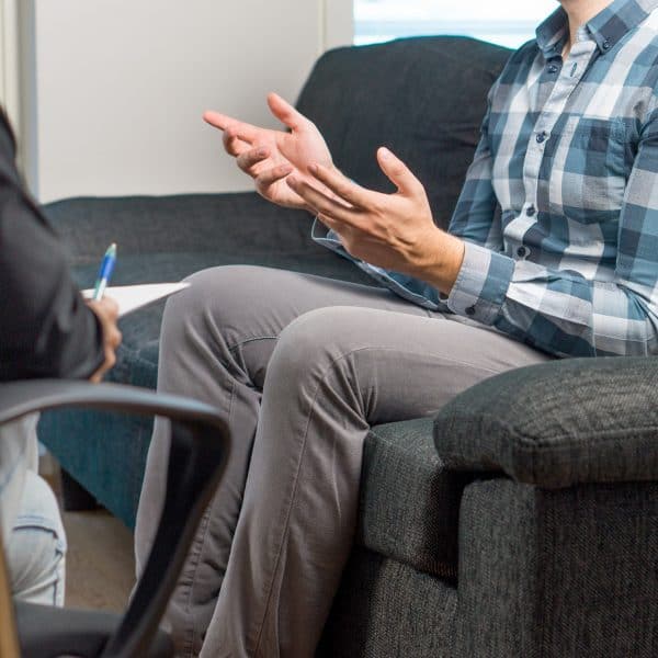 a trained therapist conducts a life coaching session