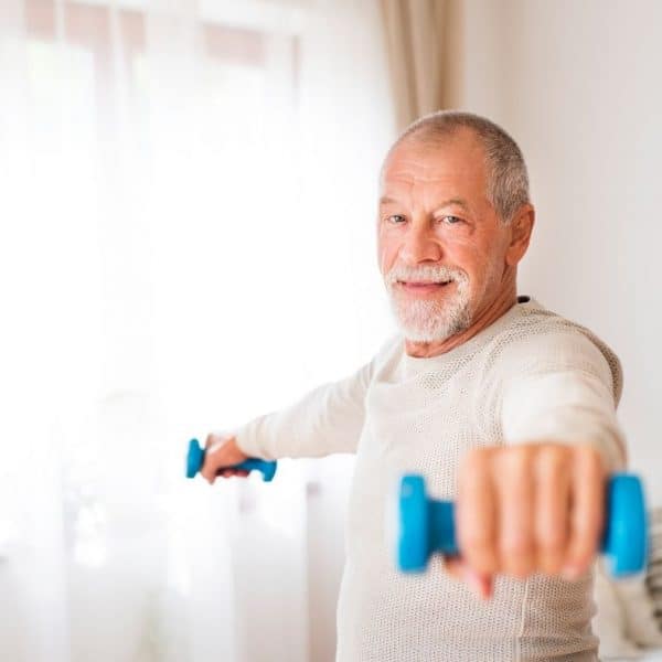 middle-aged man working out at home