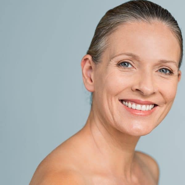 middle-aged woman with hyaluronic acid fillers for anti-ageing