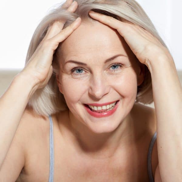 mature woman happy after anti wrinkle injections