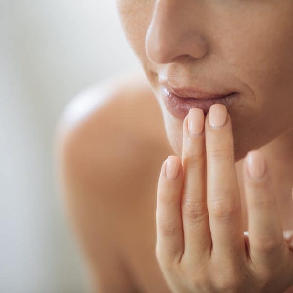 woman with lips concerns considers filler treatments