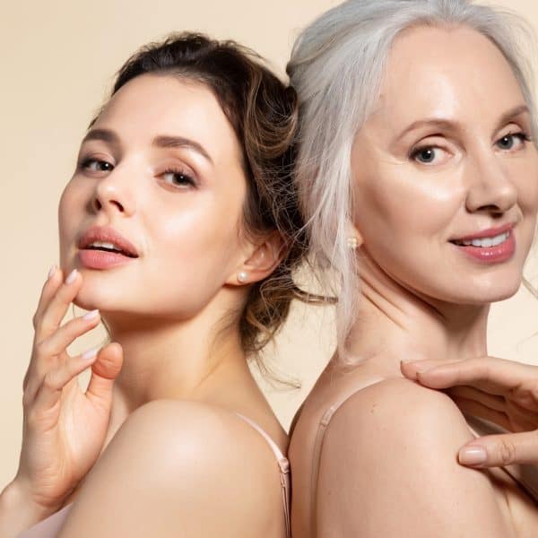 Young and mature women showing beautiful perfect skin after facial treatments